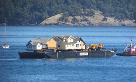 Home floats: a barge carries heritage homes from Canada to the US.