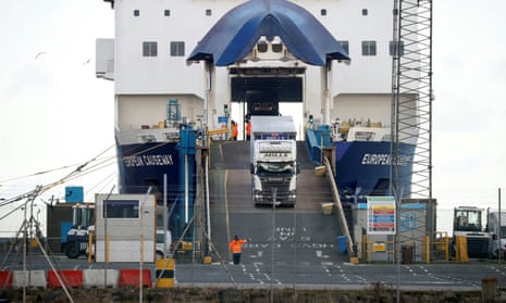Lorries disembark from a ferry at the port of Larne in Northern Ireland