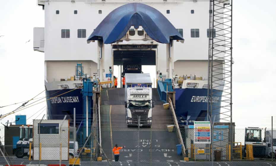 Lorries leave a ferry at the Port of Larne, Northern Ireland