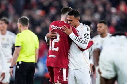 Trent Alexander-Arnold embraces his former teammate Conor Bradley.