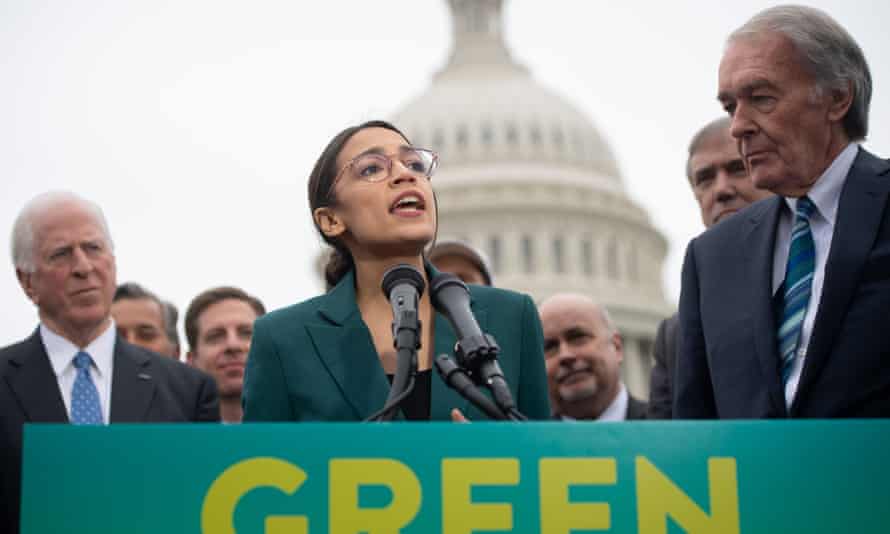 Alexandria Ocasio-Cortez speaks about the Green New Deal with Ed Markey outside the US Capitol in Washington DC, on 26 March.