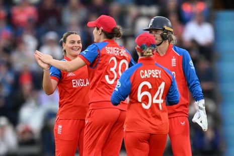 Dani Gibson of England (left) celebrates taking the wicket of Orla Prendergast of Ireland.