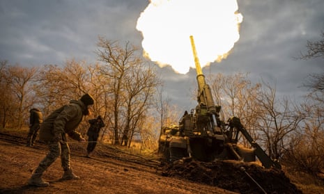 Ukrainian servicemen fire from a position on a frontline in Kherson region.