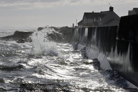 Dramatic image of the North Sea waves battering sea defences at Johnshaven, Scotland.