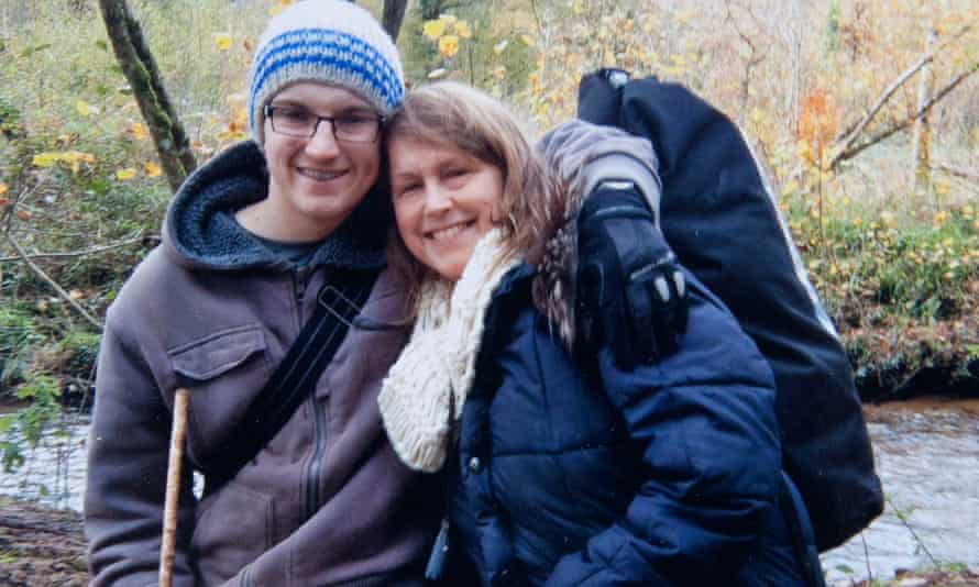 Felix photographed with his mother Sophie as a child. They are outdoors in winter coats, a river behind them.
