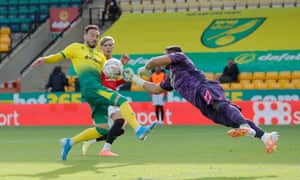 Manchester United’s goalkeeper Sergio Romero flies off his line to make a punched clearance.