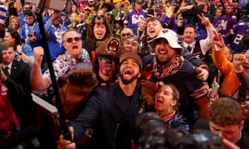 Caleb Williams celebrates with Bears fans after being selected first overall by Chicago during the first round of the 2024 NFL draft on Thursday in Detroit.