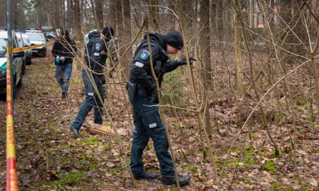 Police officers searching woods