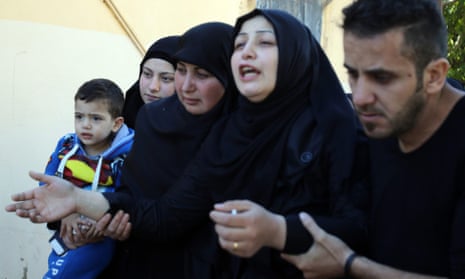 Zahra Atat, second from right, mourns her husband, Adel Tormos, who had tried to stop the second bomber entering the Shiite mosque.