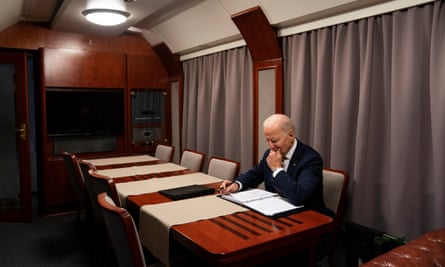 President Joe Biden goes over his speech marking the one-year anniversary of the war in the carriage now known as Rail Force One.