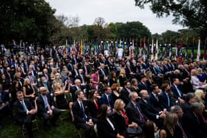 Guests listen as Donald Trump speaks with Judge Amy Coney Barrett during a ceremony to announce Barrett as nominee to the supreme court in the Rose Garden.