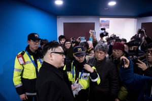 A Kim Jong-un impersonator is forced out of the women’s preliminary round ice hockey match between Japan and the unified Korean team at the Kwandong hockey centre in Gangneung.
