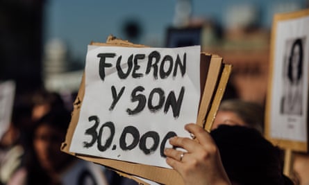 A sign saying ‘They were and are 30,000’ is held up at a demonstration by the Mothers of Plaza de Mayo in Buenos Aires this month.