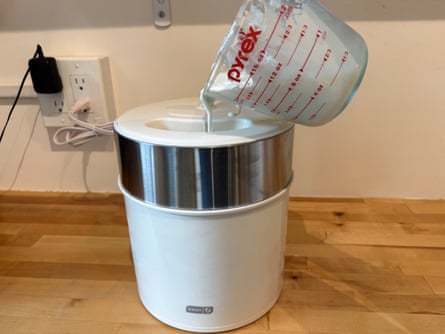 cream being poured into a Dash Deluxe Gelato & Ice Cream Maker