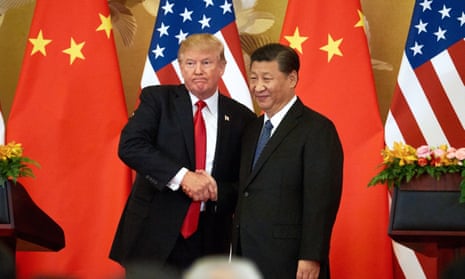 Donald Trump and China’s president Xi Jinping shake hands at the Great Hall of the People in Beijing. 