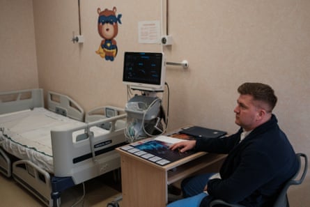 Dr Gabriel Lăzăroiu-Nistor sits in a patients’ room at the National Infectious Disease Institute in Bucharest.
