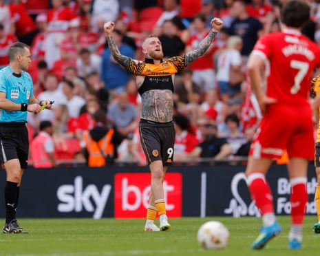 Oli McBurnie raises his arms in delight after scoring the winner.