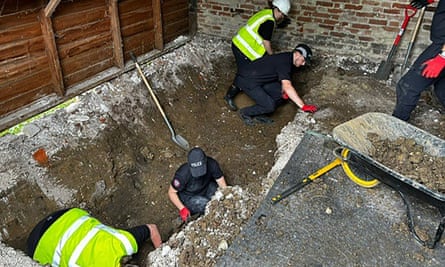 Metropolitan Police officers searching a barn at a Hertfordshire farm for the remains of Muriel McKay in July 2024.