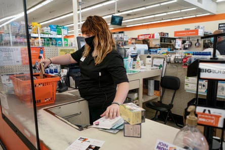 Sierra works the counter during her shift at Big Lots. Orange County, California.