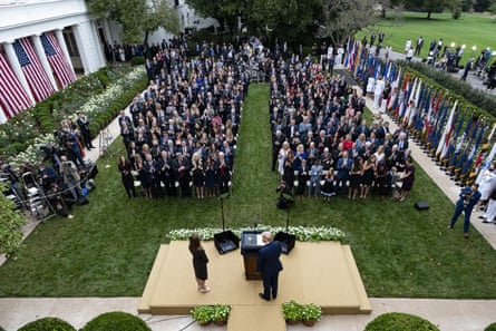 Donald Trump, center, stands with Amy Coney Barrett at an event to announce his supreme court nomination in the Rose Garden at the White House on 26 September.
