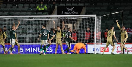 Rotherham players appeal for a goal as the ball is cleared off the line