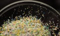 A clear dish full of brightly coloured microplastics