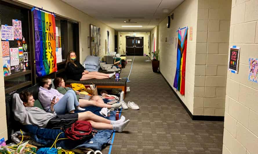 students lounge in hall as part of sit-in