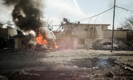 An IS car bomb targeting Iraqi troops exploded in the streets of Mosul