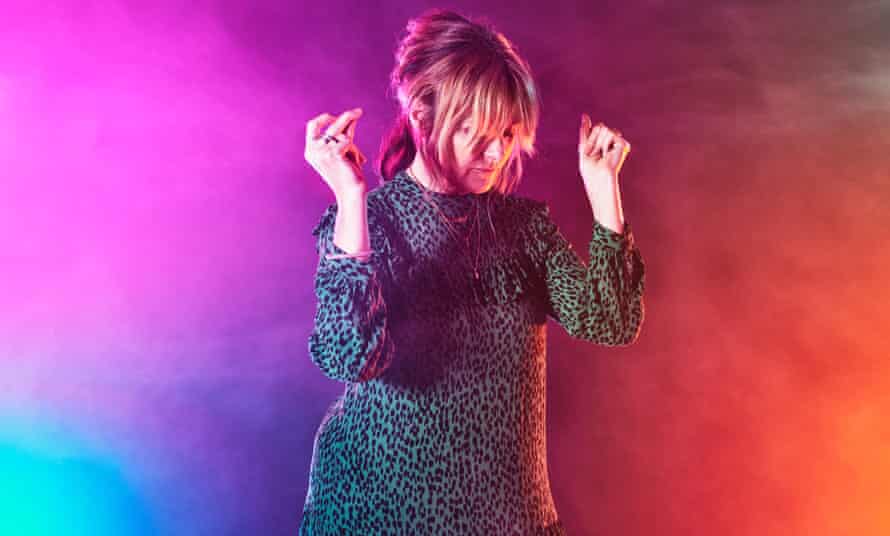 Clubber Victoria Saunders dancing against multicoloured background