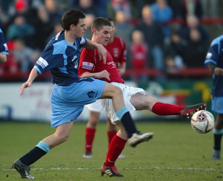 Accrington Stanley’s Anthony Barry and Cambridge United’s Darren Quinton battle for the ball in January 2006