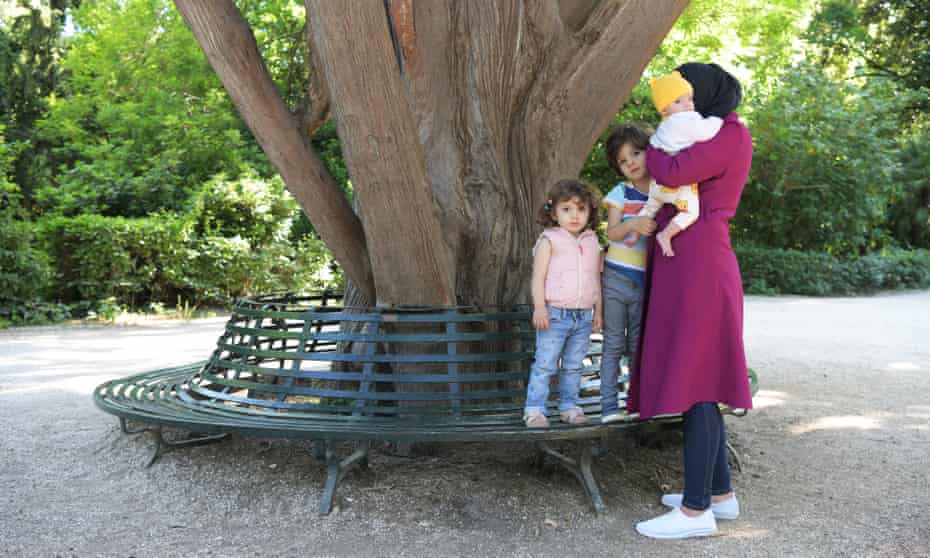 A refugee family who escaped war in Syria and now live in Athens: Maha with her three children