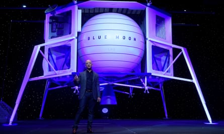 Jeff Bezos with a model of his Blue Moon lander.