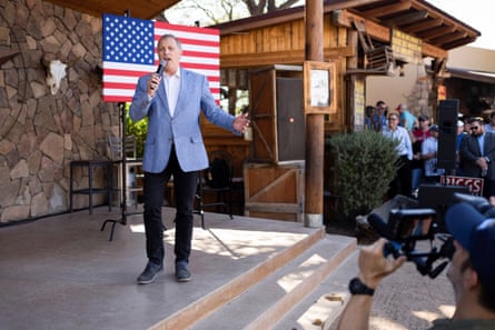 a man in a suit speaks outside