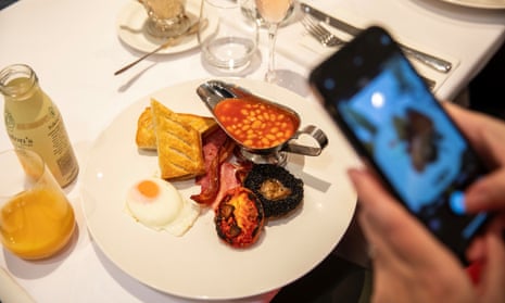 A customer takes a photo of their breakfast