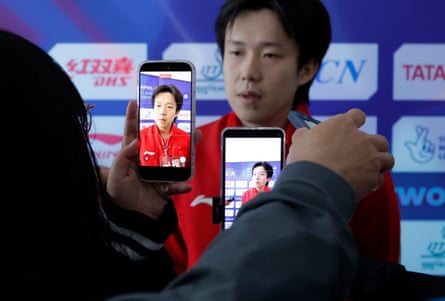 Journalists interview Wang Chuqin after China’s men beat England in their opening match