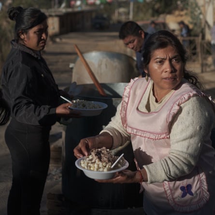 Cristina Bautista, mother of disappeared student Benjamin Ausencio, serves pozole