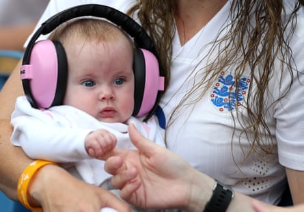 A young baby with pink noise-cancelling earphones during a group D match between England and Argentina at in Le Havre.