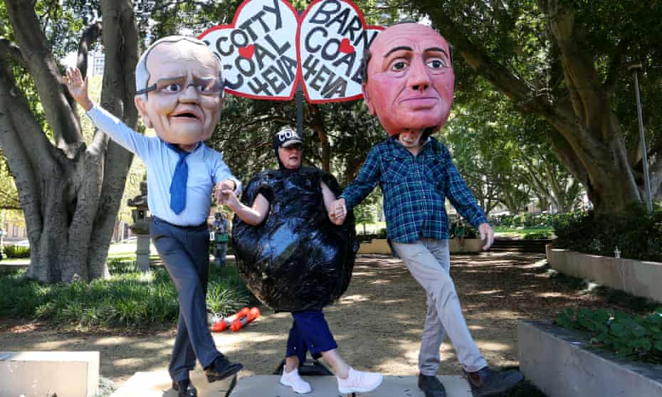Climate activists wearing masks of world leaders