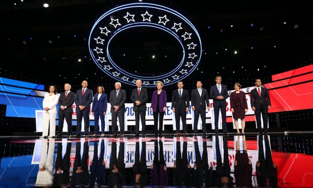 Democratic presidential candidates pose together on the debate stage