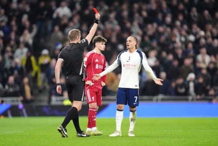 Xavi Simons is shown a red card by John Brooks following a review for a foul on Liverpool’s Virgil van Dijk.