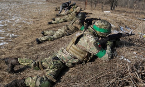 Retired foreign military personnel conduct a military exercise for Ukrainian troops outside Kharkiv