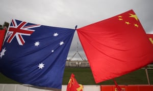 Australia’s and China’s flags on the front lawn of Parliament House in Canberra