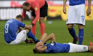 The Italian players react at the final whistle.
