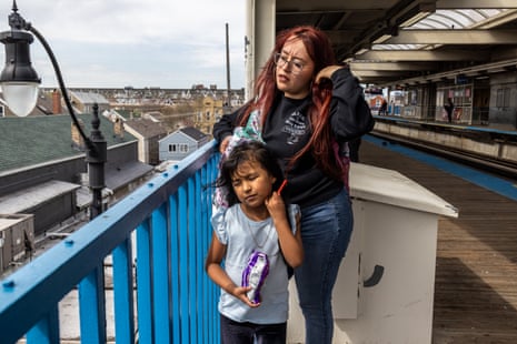 A woman and girl on a subway track