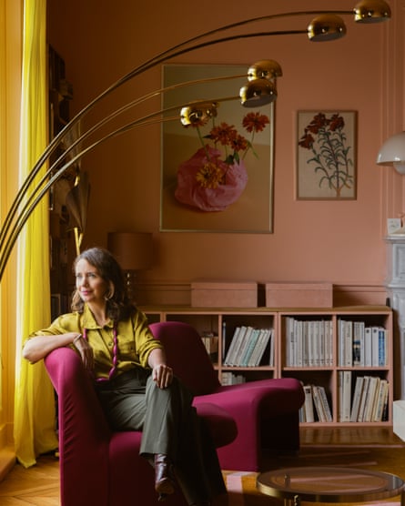 Tiphaine Verdier in the living room, beneath the lamp she bought at a flea-market.