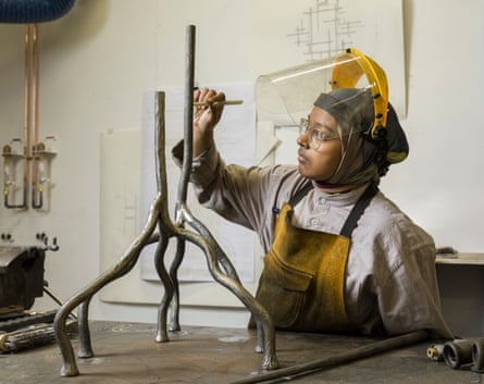 Tabassum works on a metal object