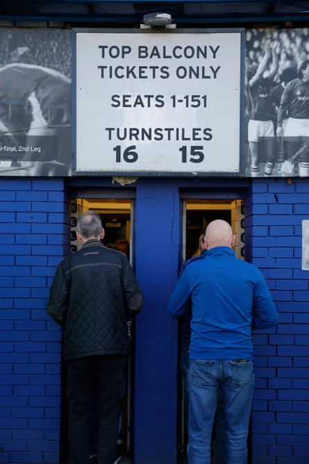 Queueing up to go through the narrow turnstiles just before kick-off in the Premier League match between Everton and Arsenal at Goodison Park on 5 April 2025.