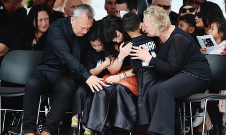 Jonah Lomu’s widow, Nadene Lomu is comforted by her two sons Brayley Lomu and Dhyreille Lomu, her mother Lois Kuiek and father Mervyn Kuiek during the public memorial.