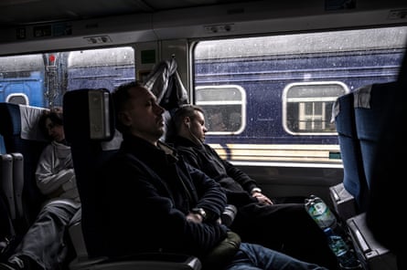 Passengers sitting in a train.