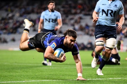 Corey Evans of the Blues scores a try during the 46-6 drubbing of the NSW Waratahs at Eden Park.
